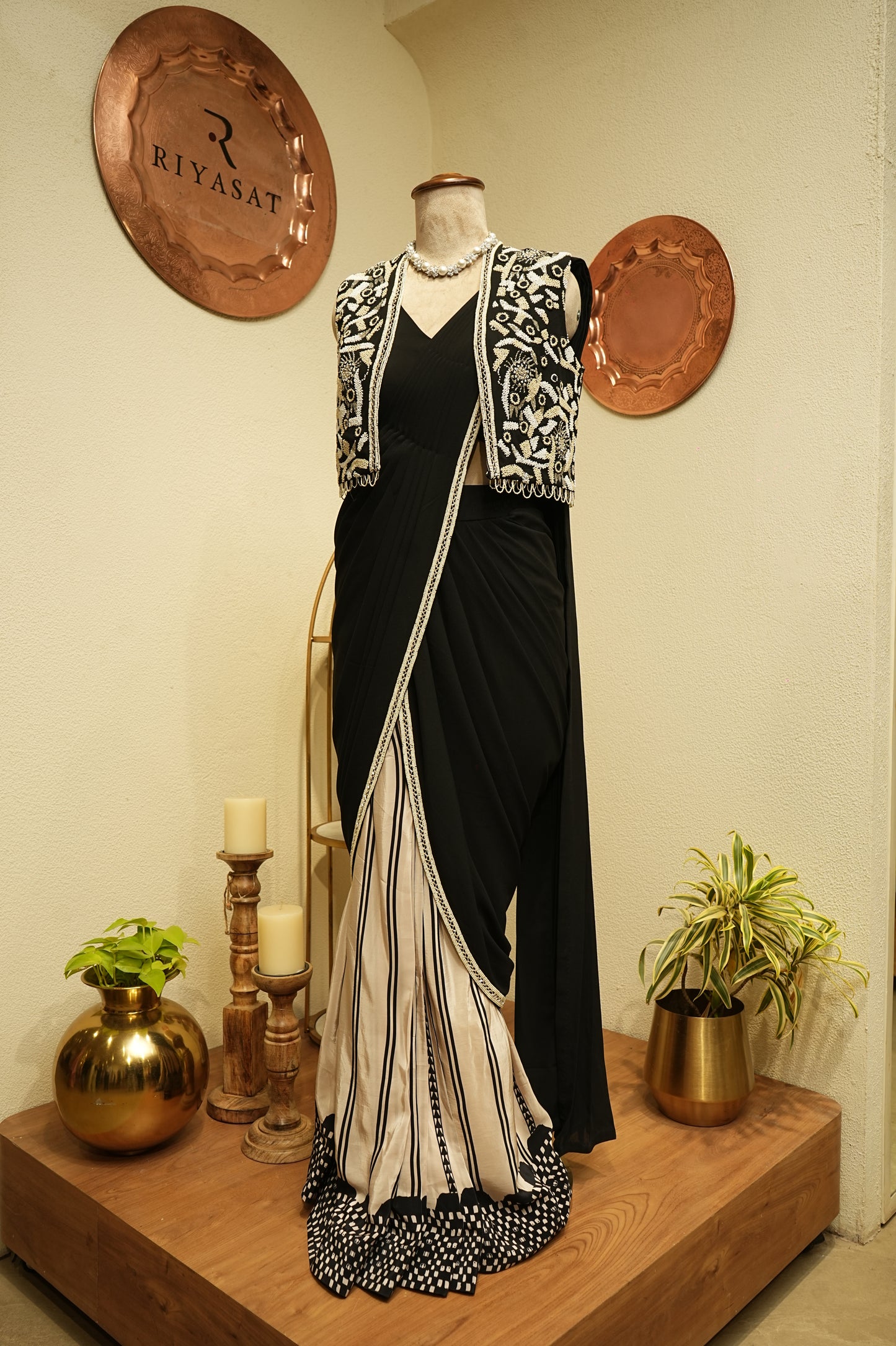 Black drapped saree with embroidered jacket