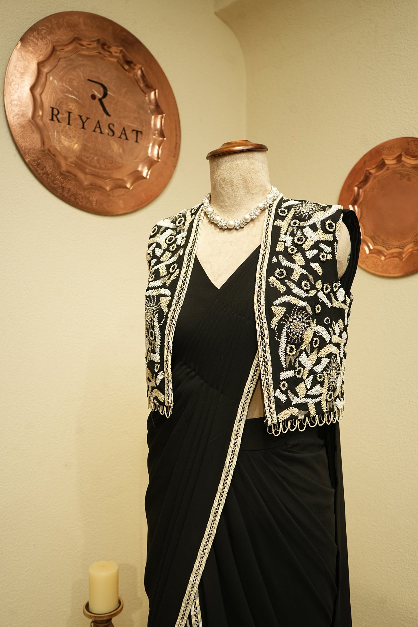 Black drapped saree with embroidered jacket
