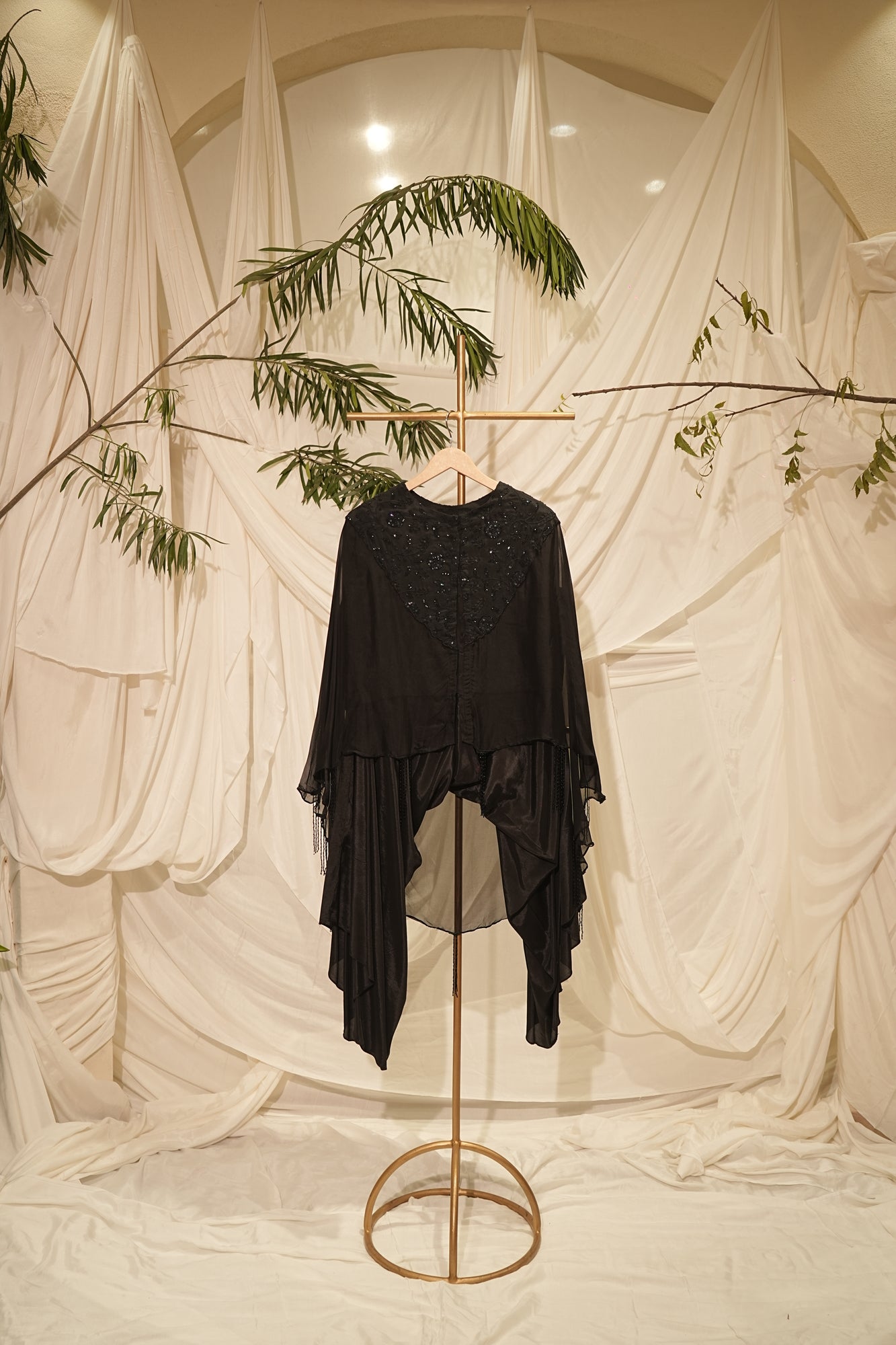black kaped dress