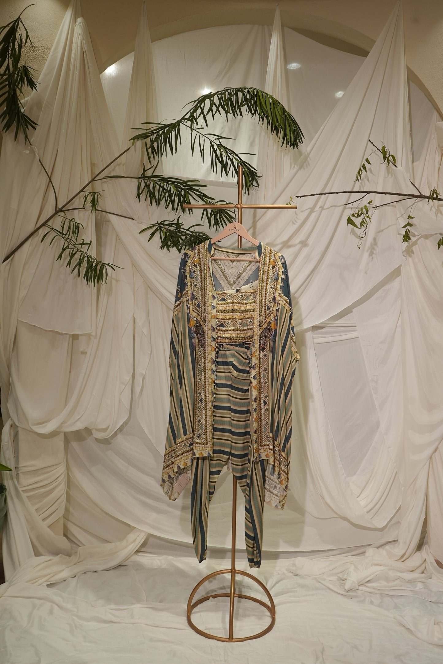 craped short top qulet draped salwar and jacket